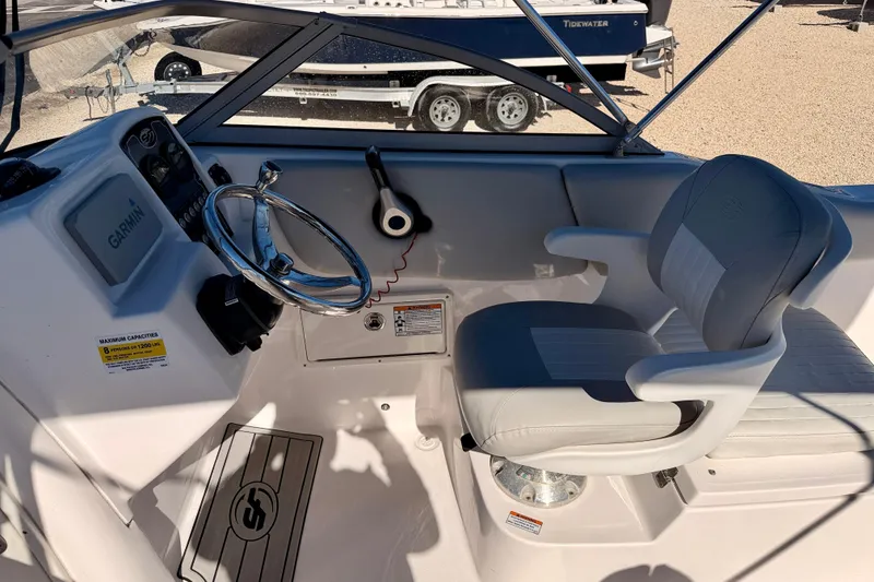 Slide: The Image of Interior of 2023 Sea Fox 228 Traveler boat with steering wheel and seating. - 12