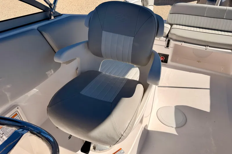 Slide: The Image of 2023 Sea Fox 228 Traveler boat seat with gray upholstery and armrests. - 17