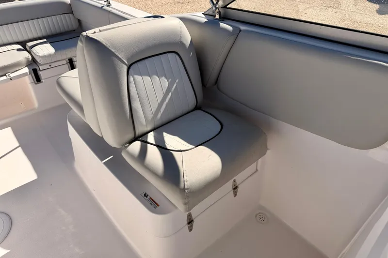 Slide: The Image of 2023 Sea Fox 228 Traveler boat interior with cushioned seating and storage. - 18