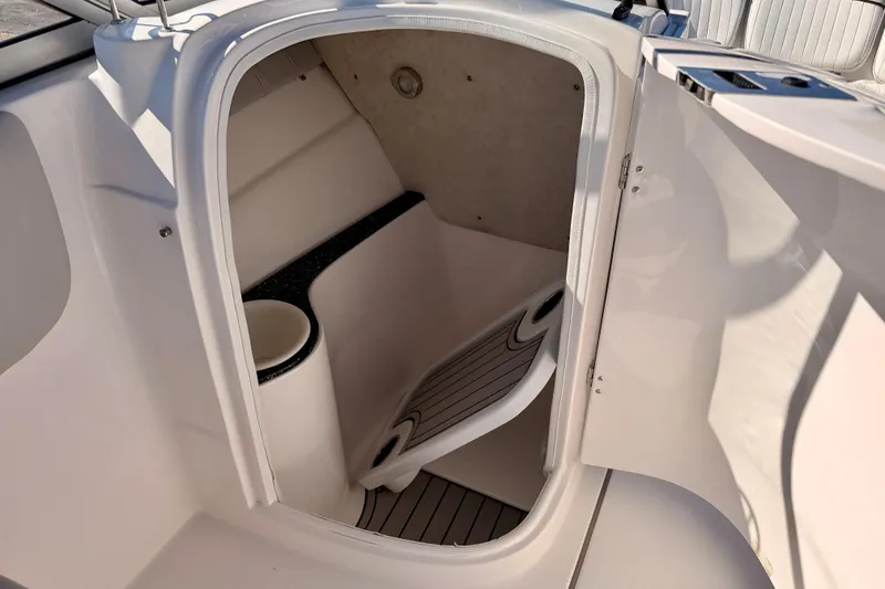 Slide: The Image of 2023 Sea Fox 228 Traveler boat interior cabin with seating and storage. - 20