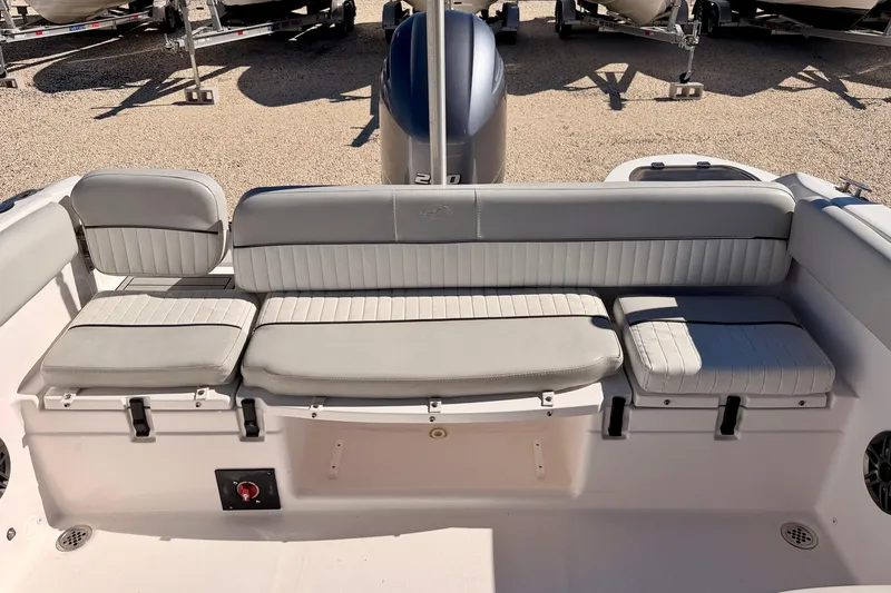 Slide: The Image of 2023 Sea Fox 228 Traveler boat interior with cushioned seating and motor view. - 27