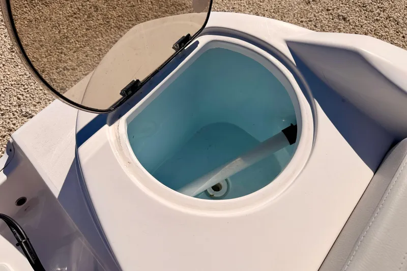 Slide: The Image of Livewell compartment on a 2023 Sea Fox 228 Traveler boat, open lid view. - 31