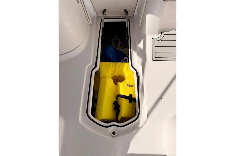 Slide: The Image of Storage compartment on 2023 Sea Fox 228 Traveler boat with yellow life jacket. - 35