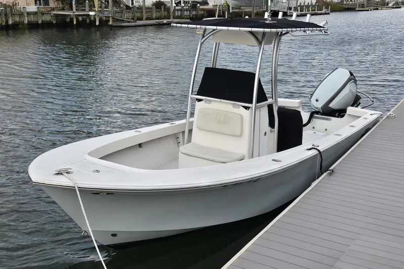 The Image of 2020 May-Craft 23 Cape Classic boat docked on calm water. - 0