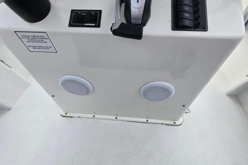 Slide: The Image of Control panel of 2020 May-Craft 23 Cape Classic boat with speakers and switches. - 13
