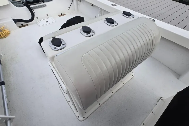 Slide: The Image of 2020 May-Craft 23 Cape Classic boat interior with cushioned seating and rod holders. - 15