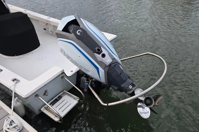 Slide: The Image of 2020 May-Craft 23 Cape Classic boat with Evinrude outboard motor on water. - 3