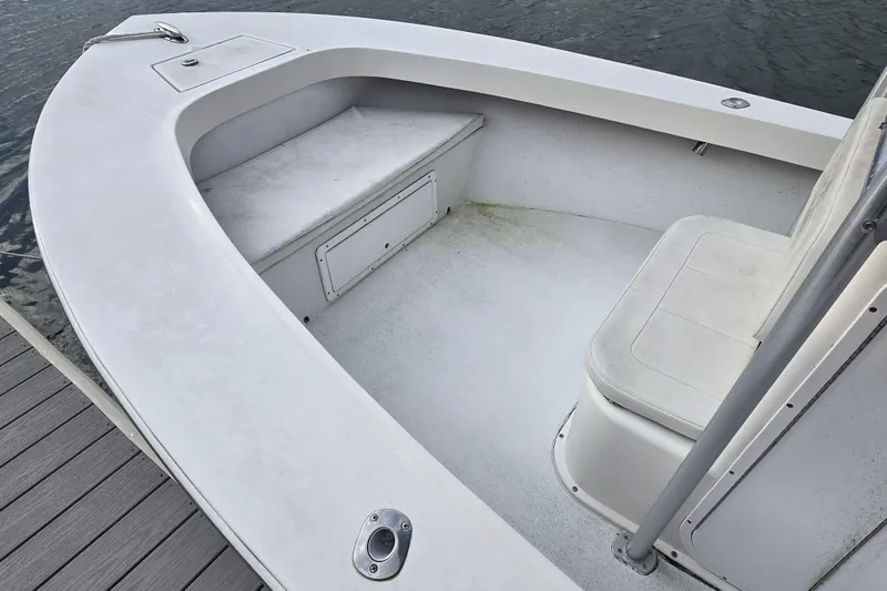 Slide: The Image of 2020 May-Craft 23 Cape Classic boat interior with seating and storage. - 6