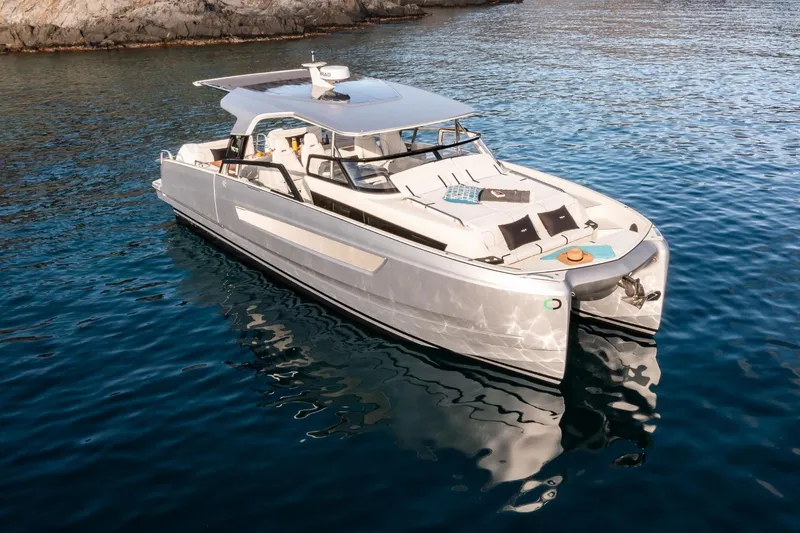 The Image of 2025 YOT 36 luxury yacht on serene blue water, showcasing sleek design and modern features. - 0