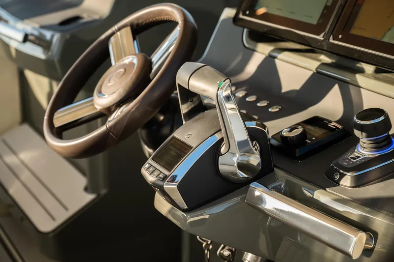 Slide: The Image of Helm of 2025 YOT 36 yacht with modern controls and steering wheel. - 16