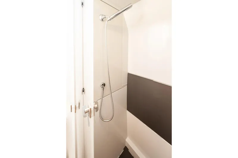 Slide: The Image of Modern shower area in 2025 YOT 36 model, featuring sleek design and chrome fixtures. - 22