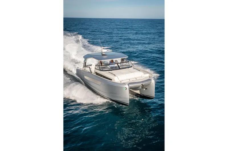Slide: The Image of 2025 YOT 36 catamaran cruising on open sea, showcasing sleek design and performance. - 3