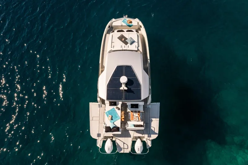 Slide: The Image of Aerial view of 2025 YOT 36 yacht on clear blue water. - 4