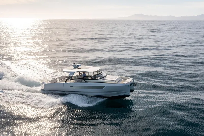Slide: The Image of Modern YOT 36 boat cruising on open sea, 2025 model, under clear sky. - 9