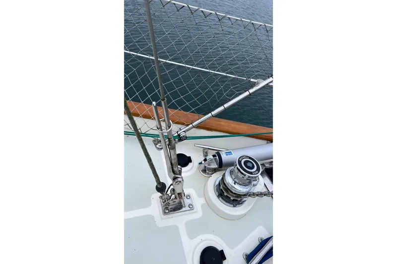 Slide: The Image of Deck view of 2006 Tayana Cutter sailboat with winch and railing details. - 13