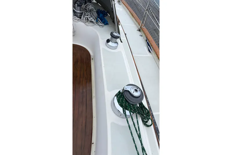 Slide: The Image of Deck of 2006 Tayana Cutter sailboat with winches and ropes. - 18