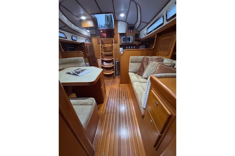 Slide: The Image of Luxurious 2006 Tayana Deck Salon interior with wood finish and cozy seating. - 2