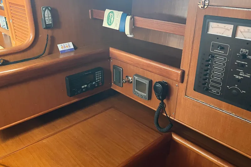 Slide: The Image of 2006 Tayana Cutter yacht interior with navigation and communication equipment. - 26
