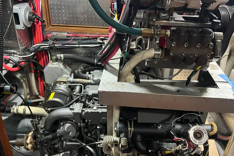 Slide: The Image of Engine compartment of a 2006 Tayana Cutter sailboat, showcasing detailed mechanical components. - 29