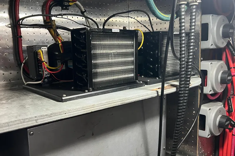 Slide: The Image of Electrical components and wiring inside a 2006 Tayana Cutter boat. - 32