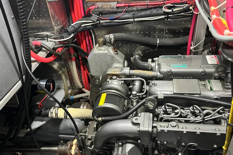 Slide: The Image of Engine compartment of a 2006 Tayana Cutter sailboat, showcasing detailed mechanical components. - 33