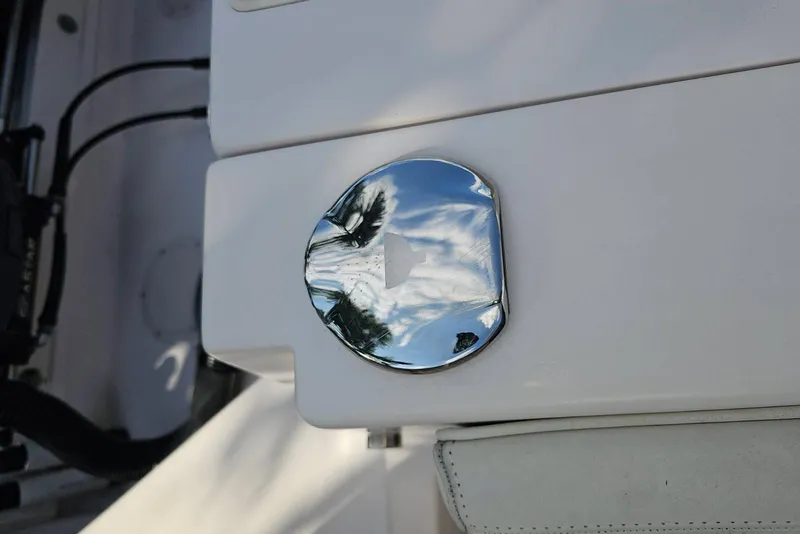 Slide: The Image of Chrome detail on 2006 Grady-White Sailfish 282 boat, reflecting sky and trees. - 10