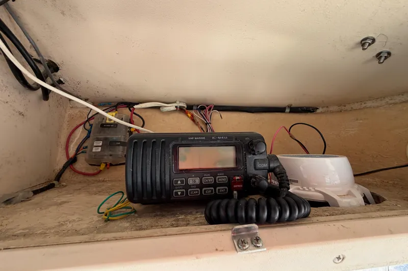 Slide: The Image of VHF marine radio and wiring inside a 2006 Grady-White Sailfish 282 boat. - 111