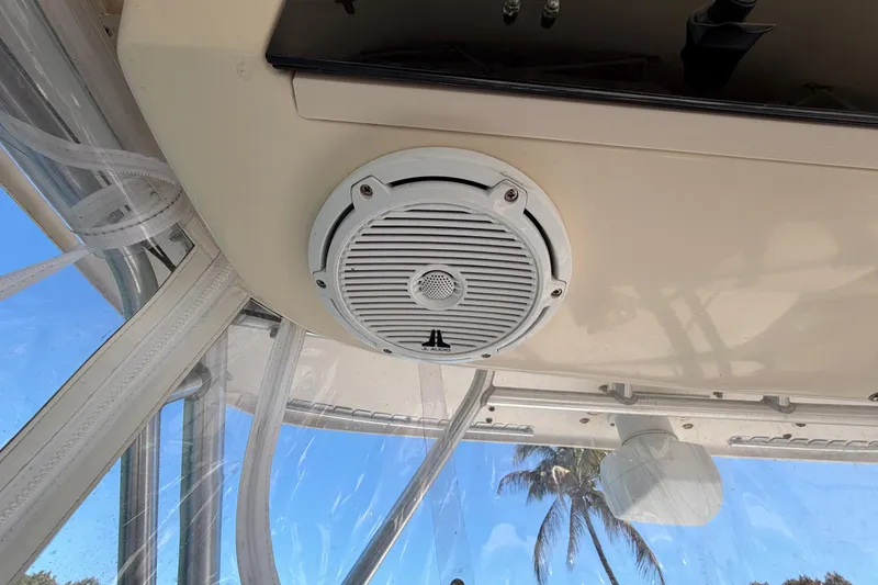 Slide: The Image of 2006 Grady-White Sailfish 282 boat interior with speaker and clear canopy. - 114
