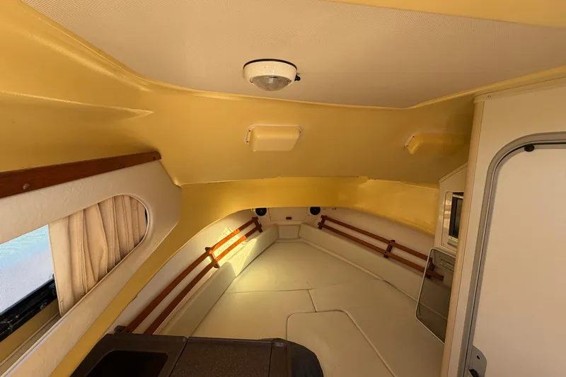 Slide: The Image of Interior cabin of 2006 Grady-White Sailfish 282 boat, featuring cozy seating and storage. - 118