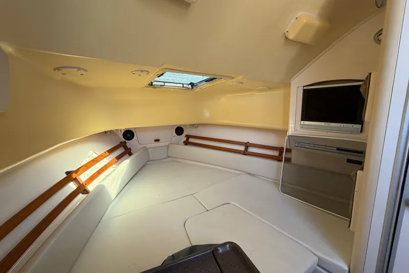 Slide: The Image of 2006 Grady-White Sailfish 282 cabin interior with TV and skylight. - 123