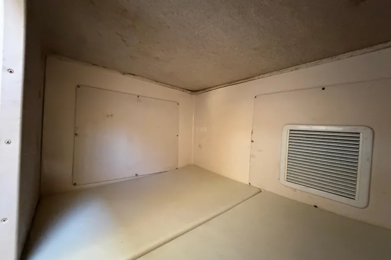 Slide: The Image of Interior cabin of 2006 Grady-White Sailfish 282 boat, featuring a vented wall. - 149