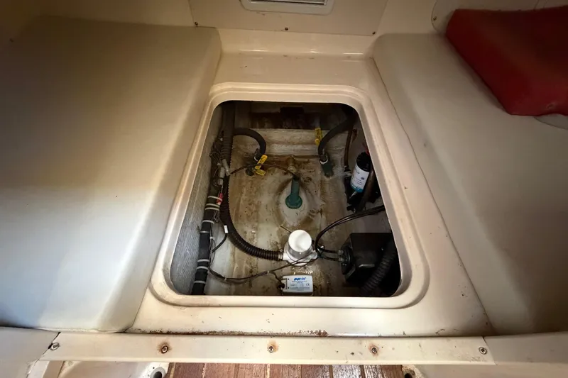 Slide: The Image of 2006 Grady-White Sailfish 282 interior compartment with wiring and equipment. - 153