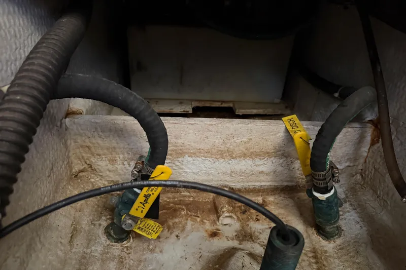 Slide: The Image of Bilge area of 2006 Grady-White Sailfish 282 with hoses and labels. - 156