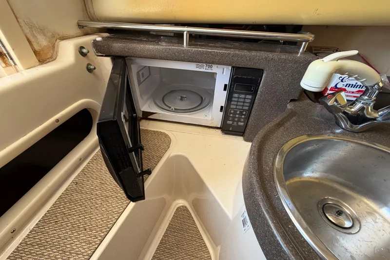 Slide: The Image of 2006 Grady-White Sailfish 282 interior with microwave and sink. - 164