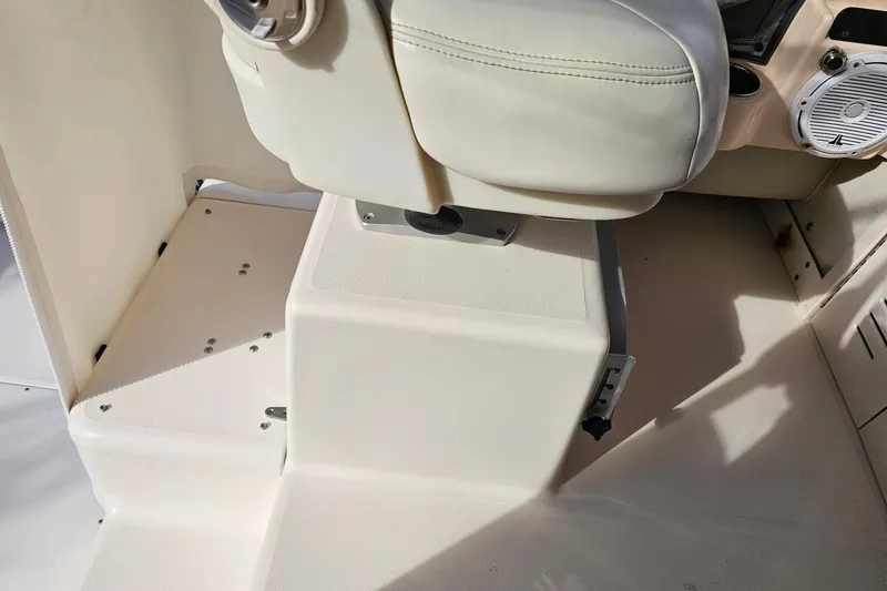 Slide: The Image of 2006 Grady-White Sailfish 282 boat interior with seating and speaker detail. - 18