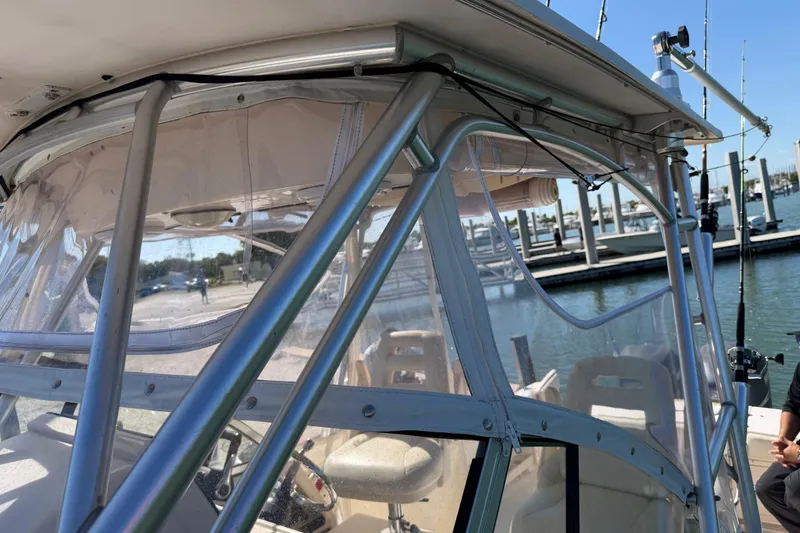 Slide: The Image of 2006 Grady-White Sailfish 282 boat with clear enclosure at marina. - 185