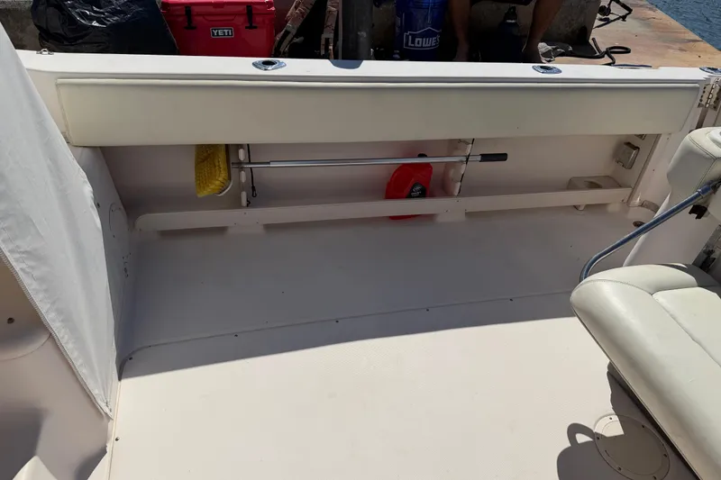 Slide: The Image of 2006 Grady-White Sailfish 282 boat interior with storage and seating area. - 189