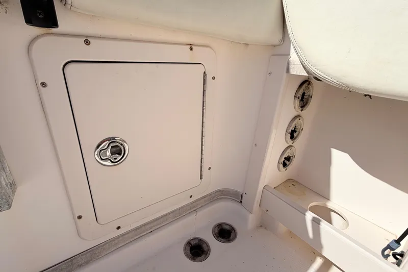 Slide: The Image of 2006 Grady-White Sailfish 282 boat interior storage compartment and seating area. - 192