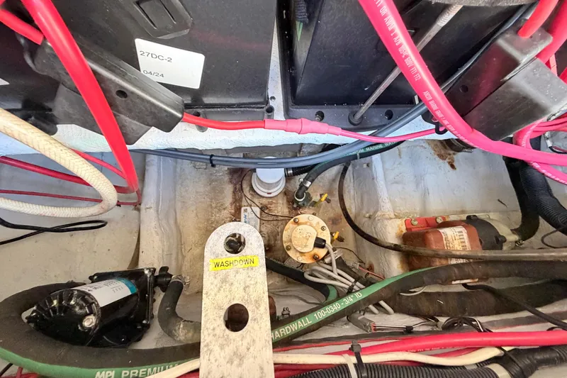 Slide: The Image of 2006 Grady-White Sailfish 282 boat wiring and components in engine compartment. - 195