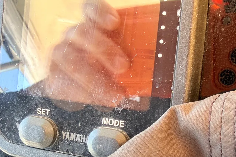Slide: The Image of Close-up of a Yamaha control panel on a 2006 Grady-White Sailfish 282 boat. - 206