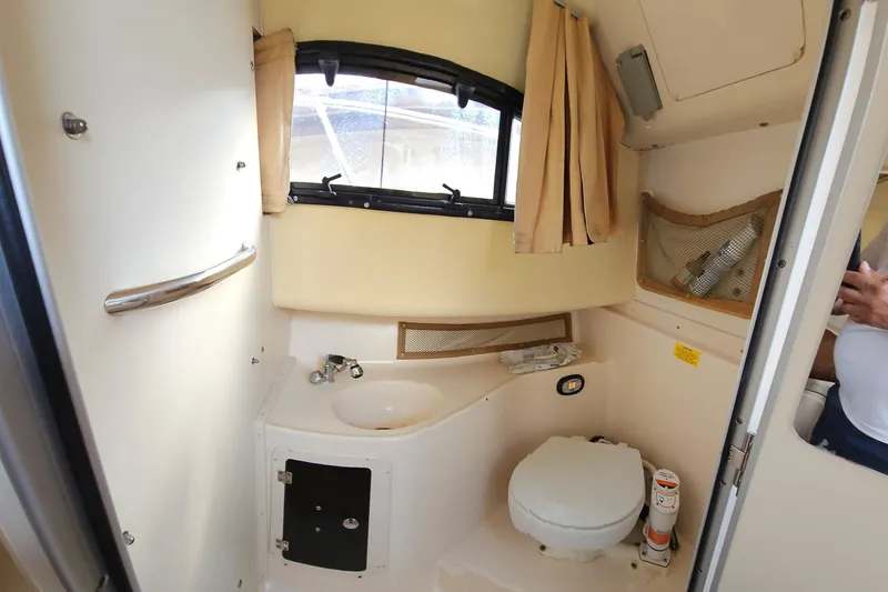 Slide: The Image of 2006 Grady-White Sailfish 282 boat interior bathroom with sink and toilet. - 27