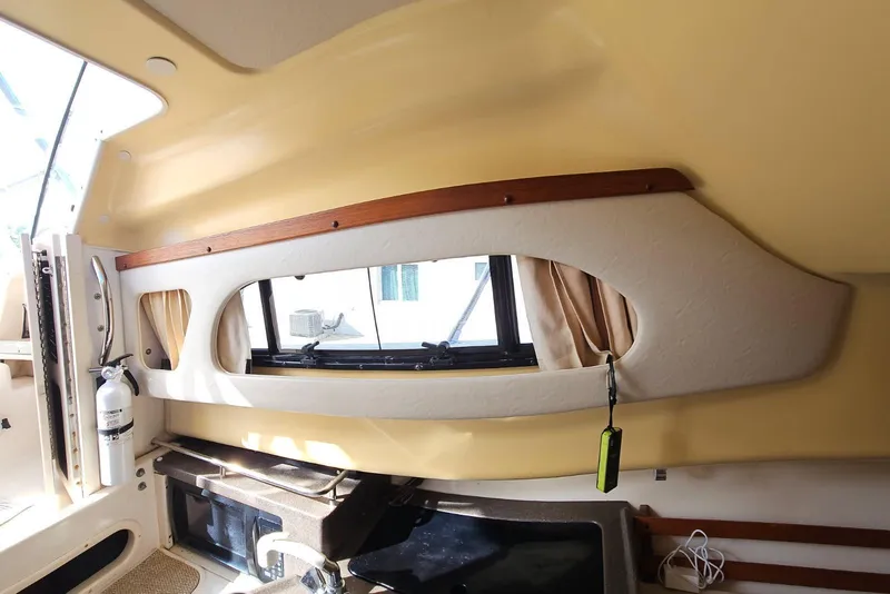 Slide: The Image of Interior of 2006 Grady-White Sailfish 282 boat, featuring window and safety equipment. - 28