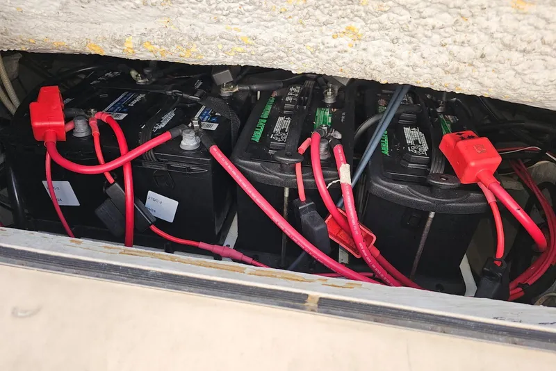 Slide: The Image of Batteries and wiring inside a 2006 Grady-White Sailfish 282 boat compartment. - 31