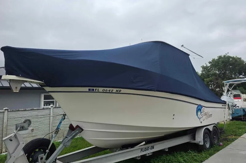 Slide: The Image of 2006 Grady-White Sailfish 282 boat on trailer, covered, parked outdoors. - 32