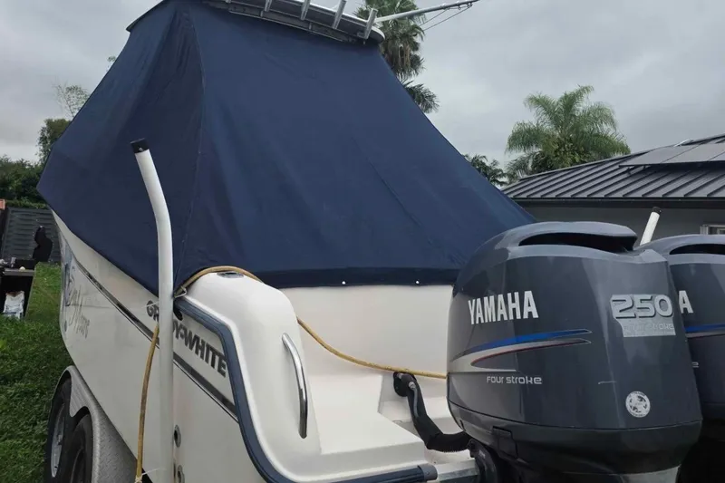 Slide: The Image of 2006 Grady-White Sailfish 282 boat with Yamaha 250 engines, covered and parked outdoors. - 33