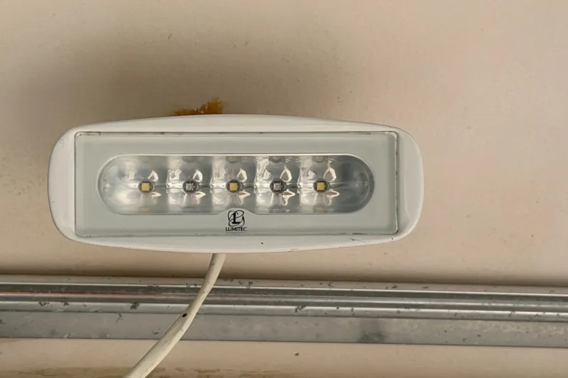 Slide: The Image of LED light fixture on a 2006 Grady-White Sailfish 282 boat ceiling. - 40