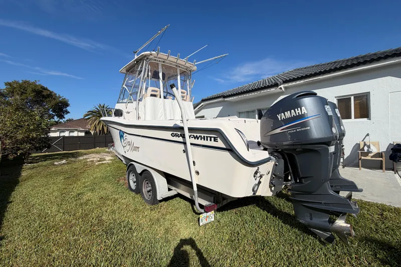 Slide: The Image of 2006 Grady-White Sailfish 282 boat with Yamaha engine on trailer in yard. - 44