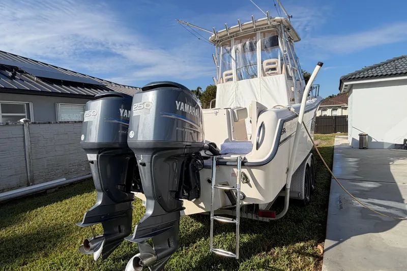 Slide: The Image of 2006 Grady-White Sailfish 282 boat with twin Yamaha 250 engines parked outdoors. - 52