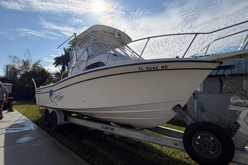 Slide: The Image of 2006 Grady-White Sailfish 282 boat on trailer under sunny sky. - 56