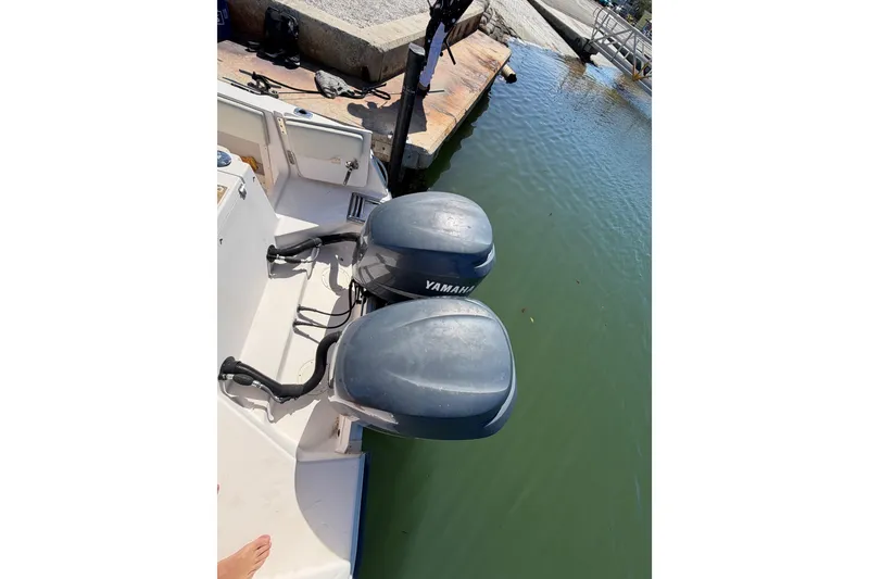 Slide: The Image of 2006 Grady-White Sailfish 282 with dual Yamaha outboard motors at dock. - 68